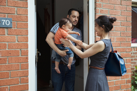 Mother picking up child from dad's house