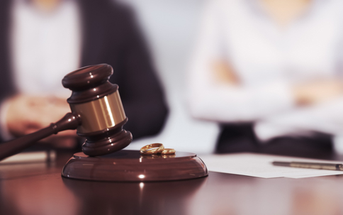 Gavel and wedding rings